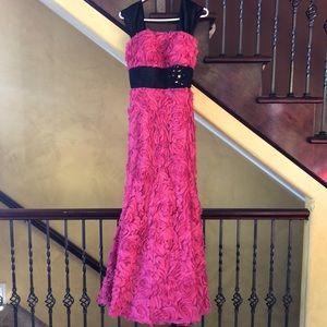 This black and hot pink has only been worn once and is in perfect condition